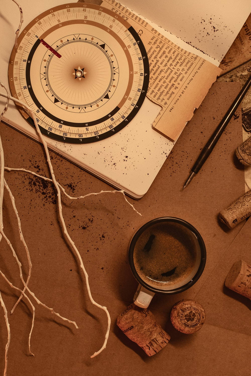 Light Brown Aesthetic Compass And Coffee Wallpaper