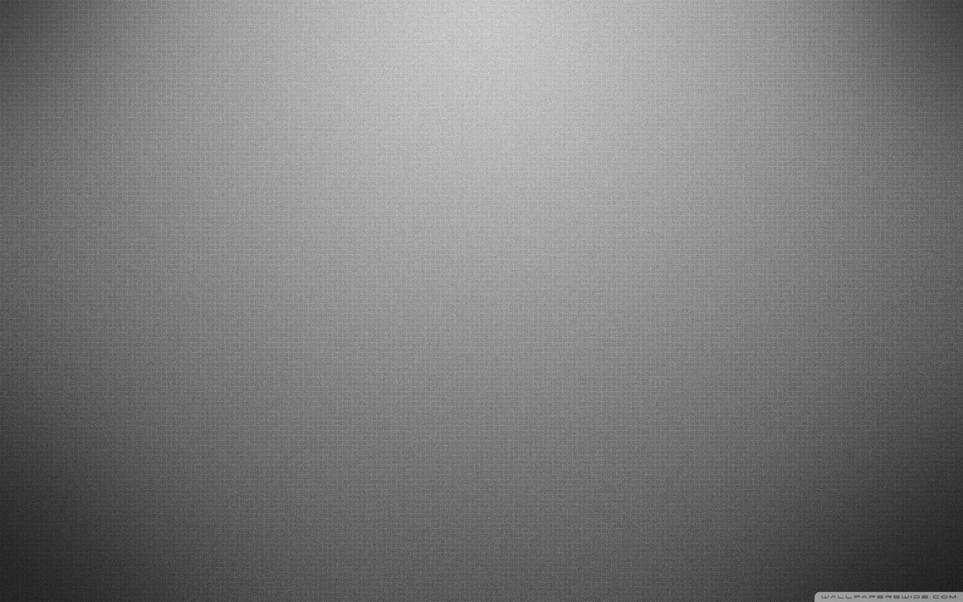 A Grey Background With A Light Shining On It Wallpaper