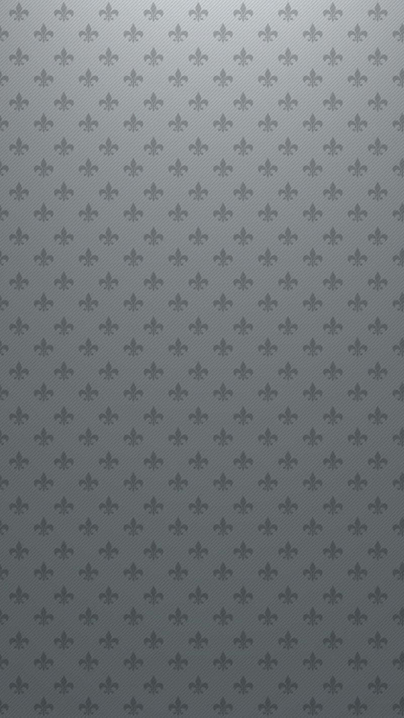 Lys grå iPhone mod en hvid overflade. Wallpaper