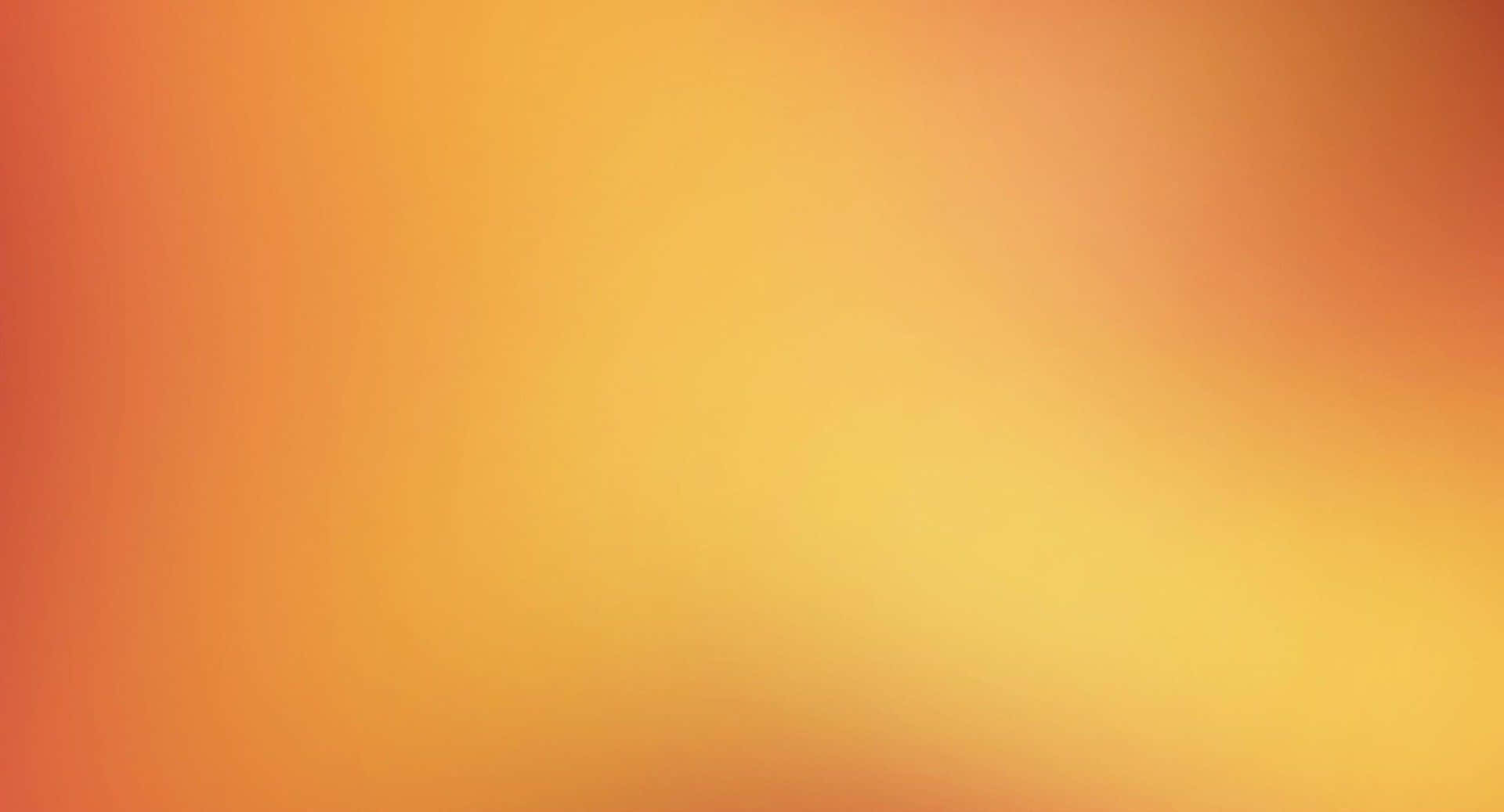 A Blurred Orange And Yellow Background