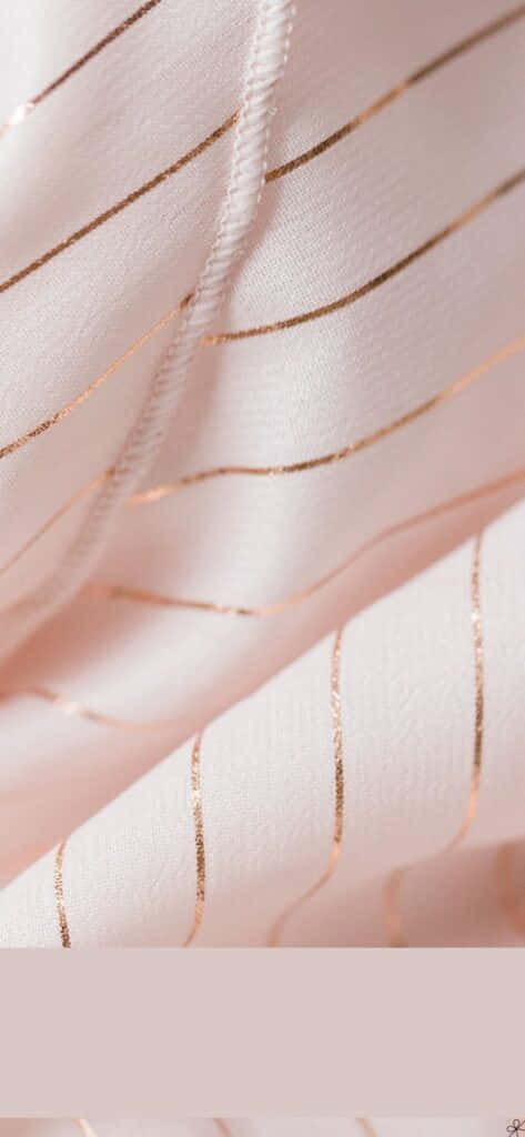 Vibrant combination of light pink and gold hues Wallpaper