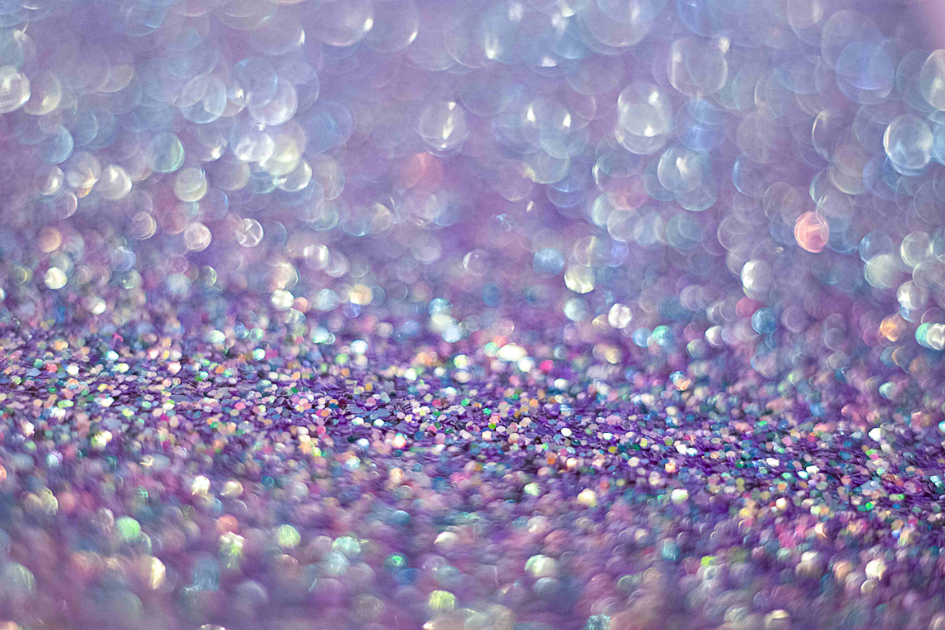A Purple And Blue Glittery Background