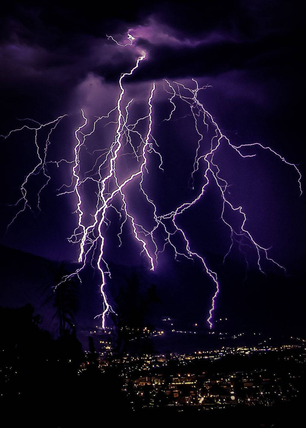 Light Purple Lightning Over City Background