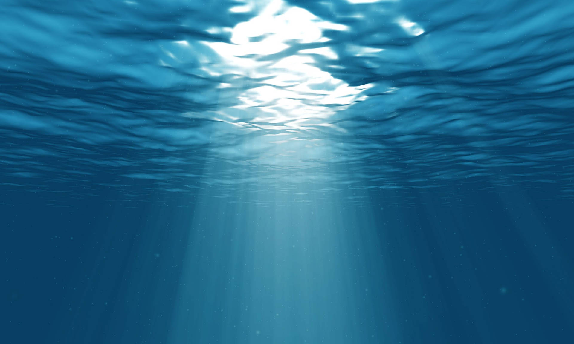 Shining Light Seeping Through a Blue Underwater World Wallpaper