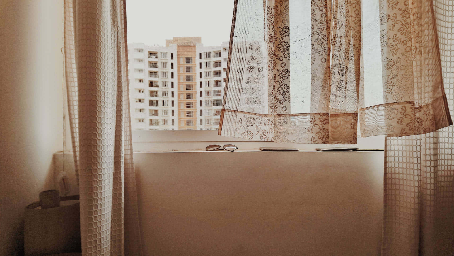 A Bed With A Window And A Curtain