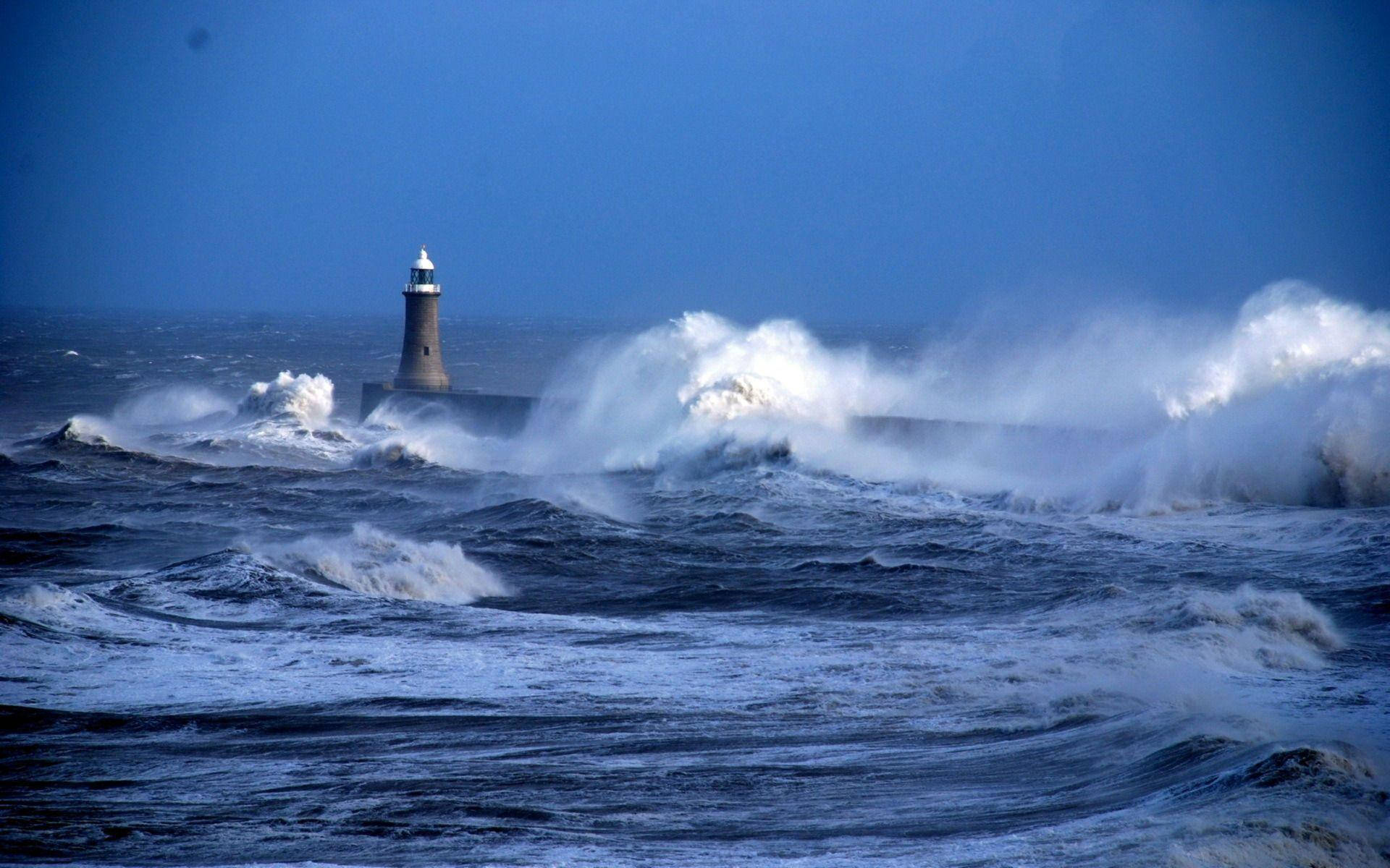 Lighthouse Amongst Waves Wallpaper