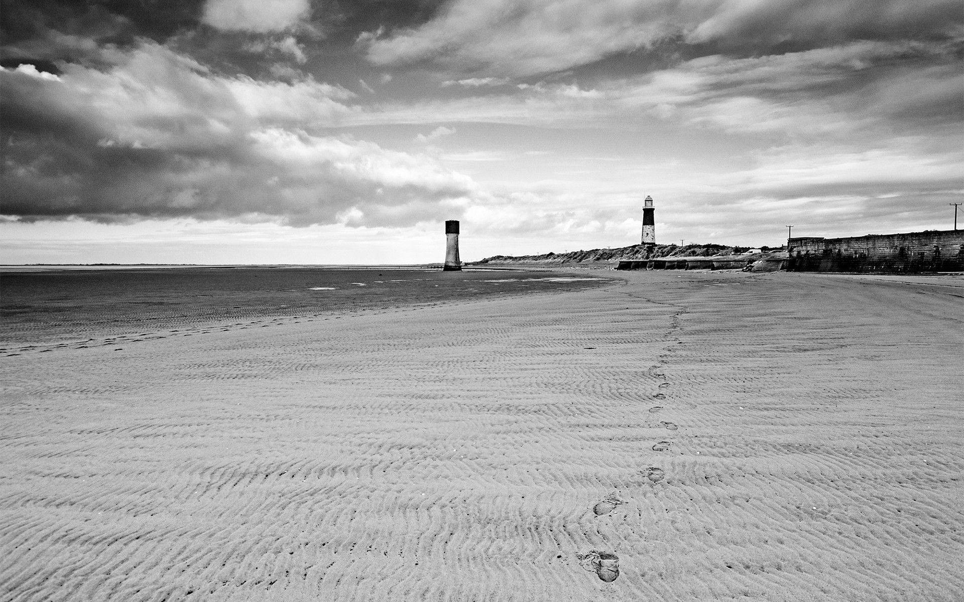 Lighthouse Footsteps In Sand Wallpaper