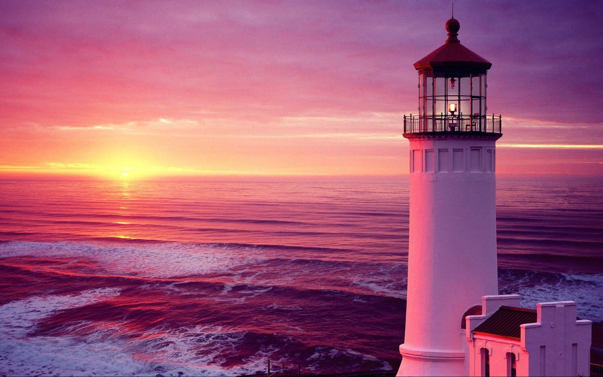 Leuchtturmbei Rosa Sonnenuntergang Wallpaper