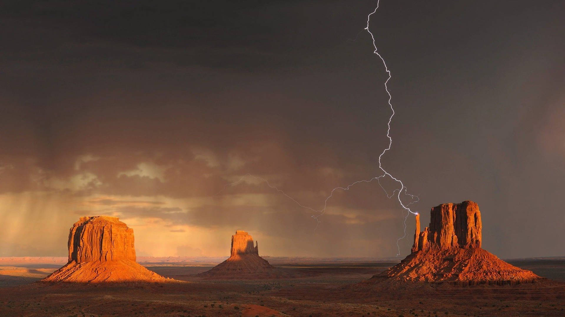 Lightning At Monument Valley Wallpaper