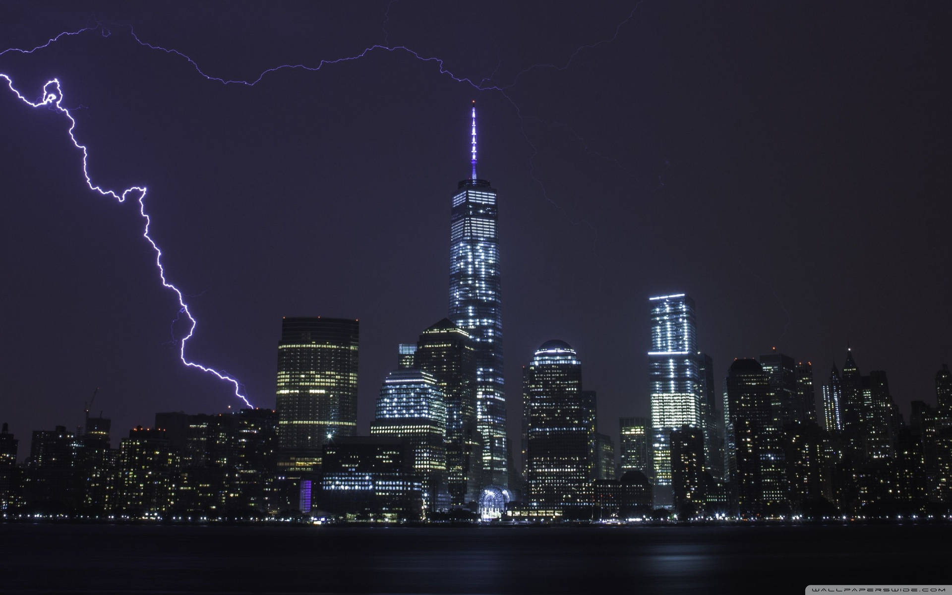 Electric Night: Intense Lightning Strike Over City Skyline Wallpaper