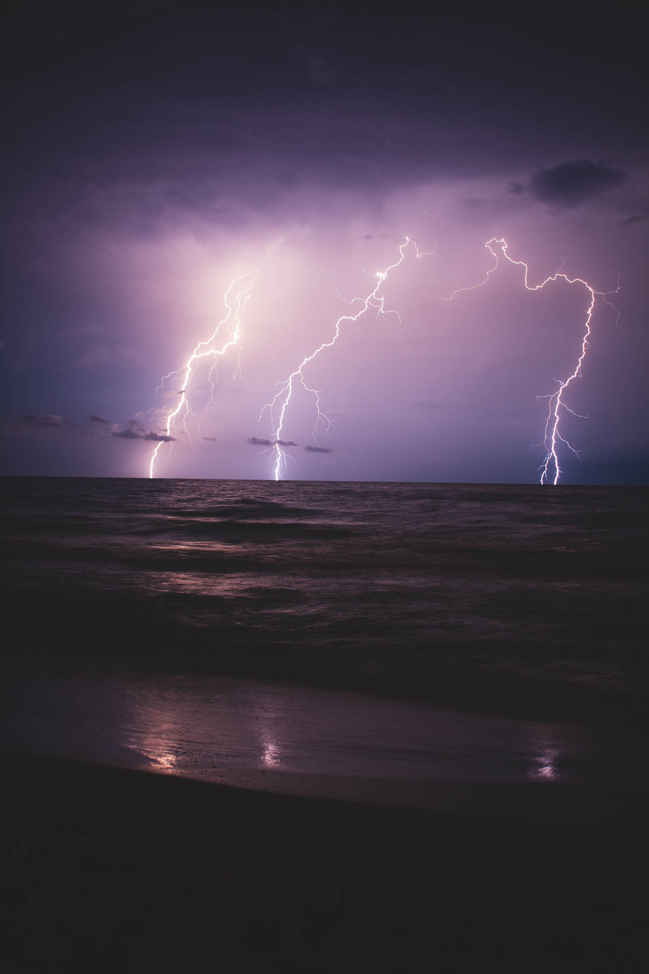 A beautiful lightning storm at the beach. Wallpaper