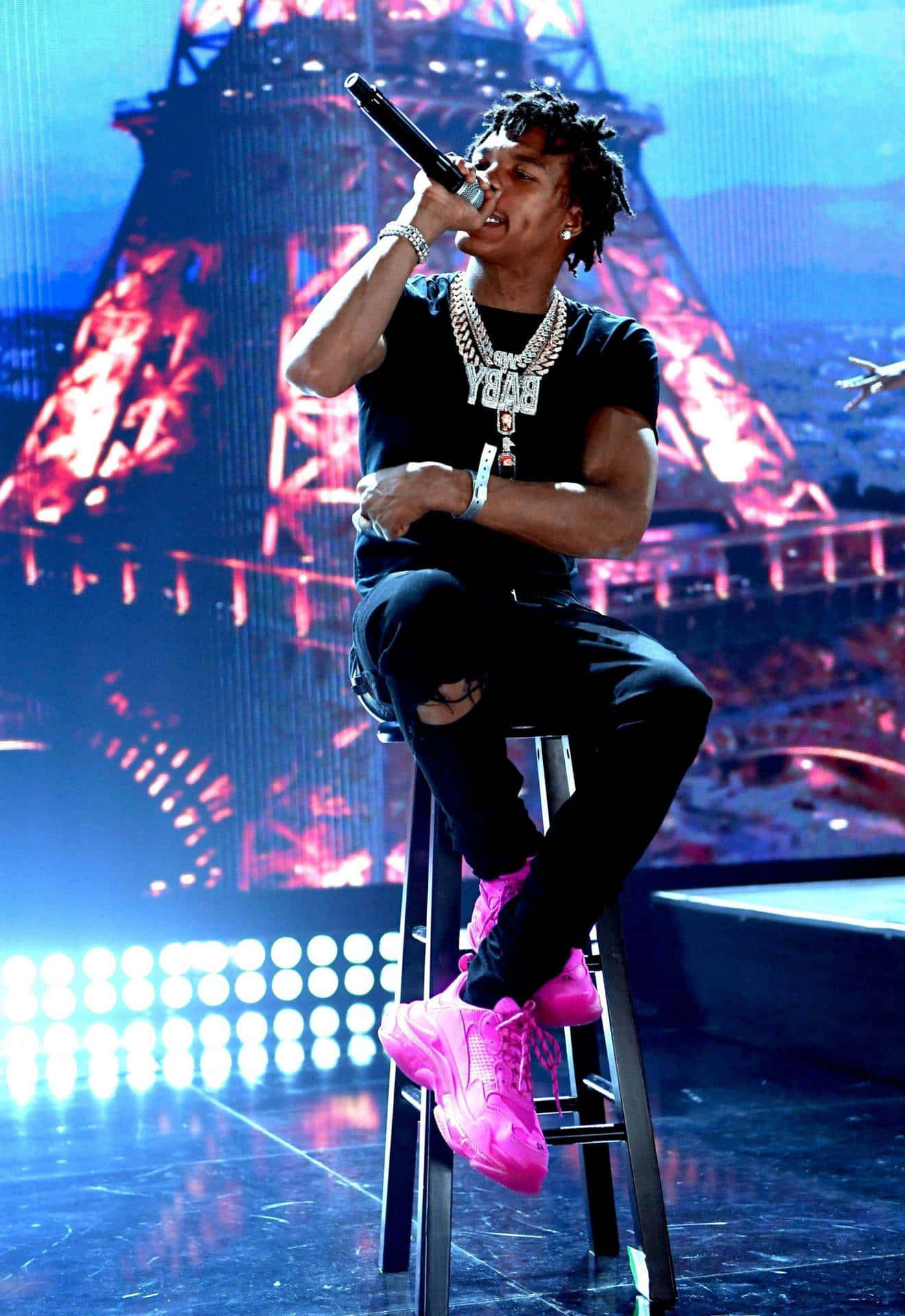 Lil Baby Performing On Stage Wallpaper