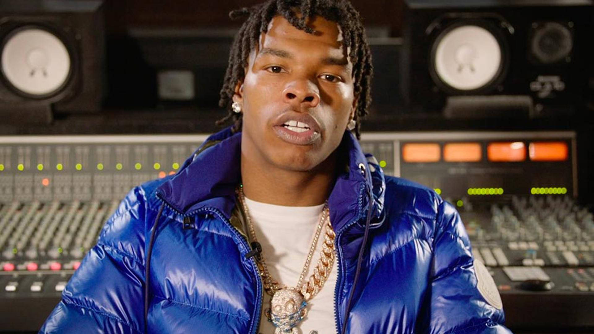 Lil Baby Seated Inside Recording Studio Wallpaper