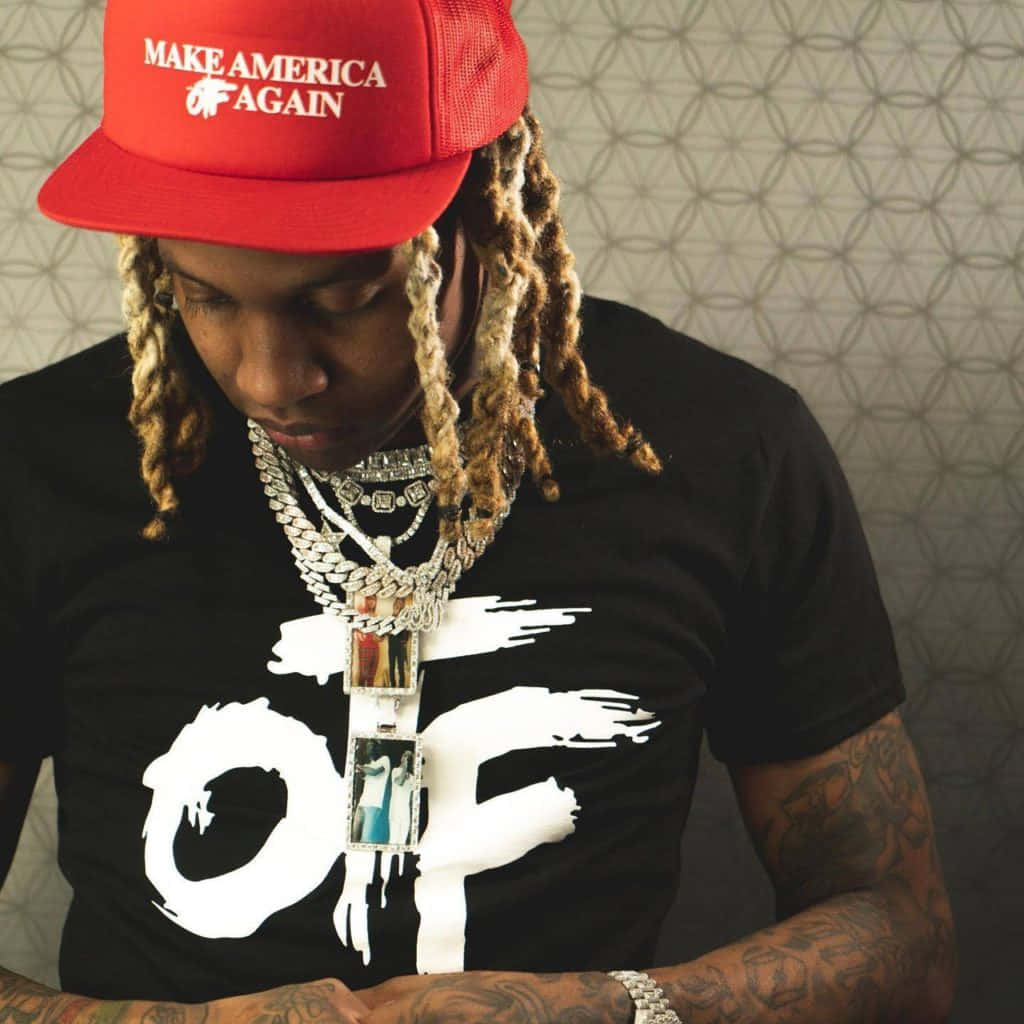 Download Lil Durk striking a pose in a stylish outfit