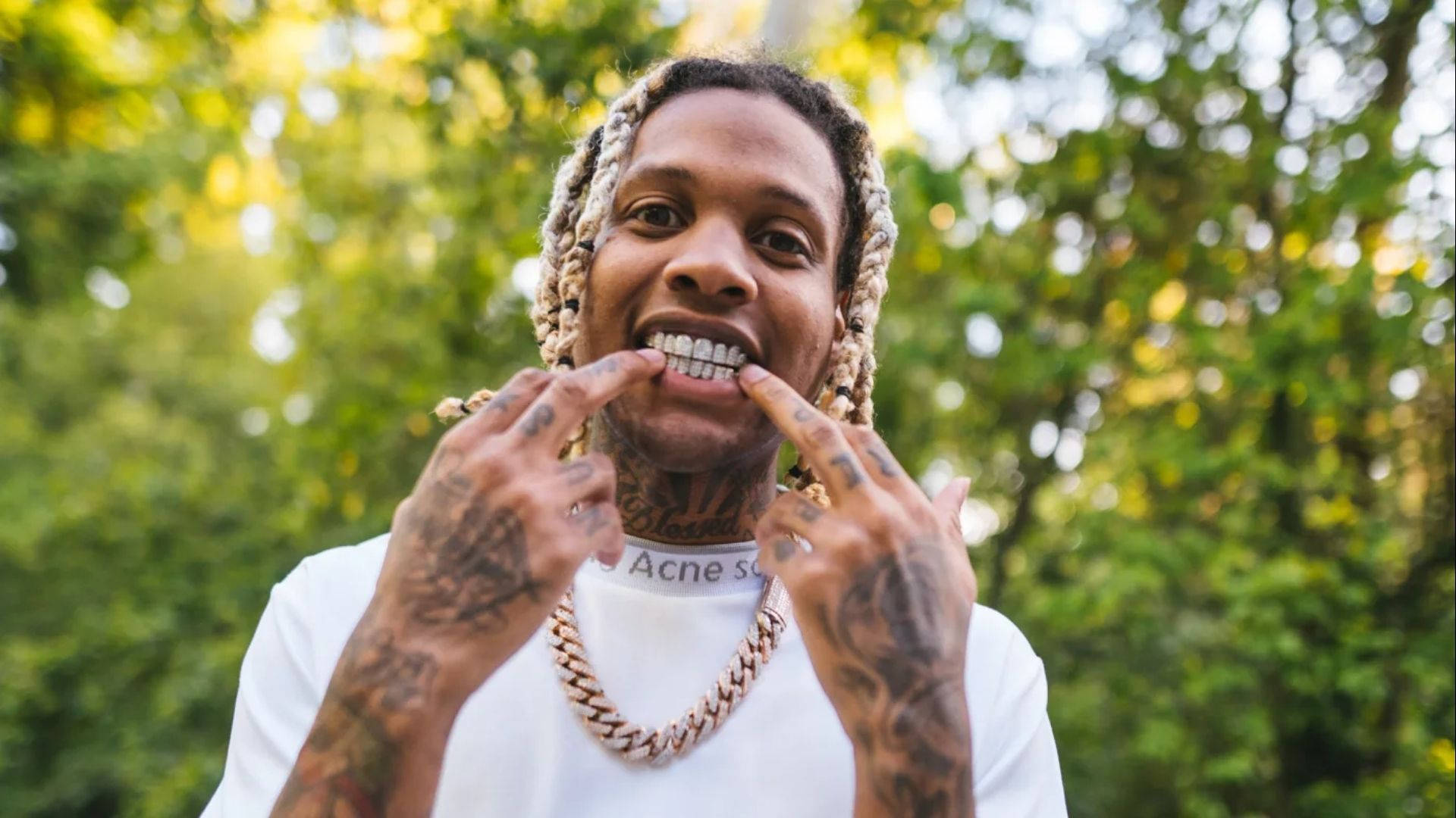 Lil Durk Showing His Teeth Background