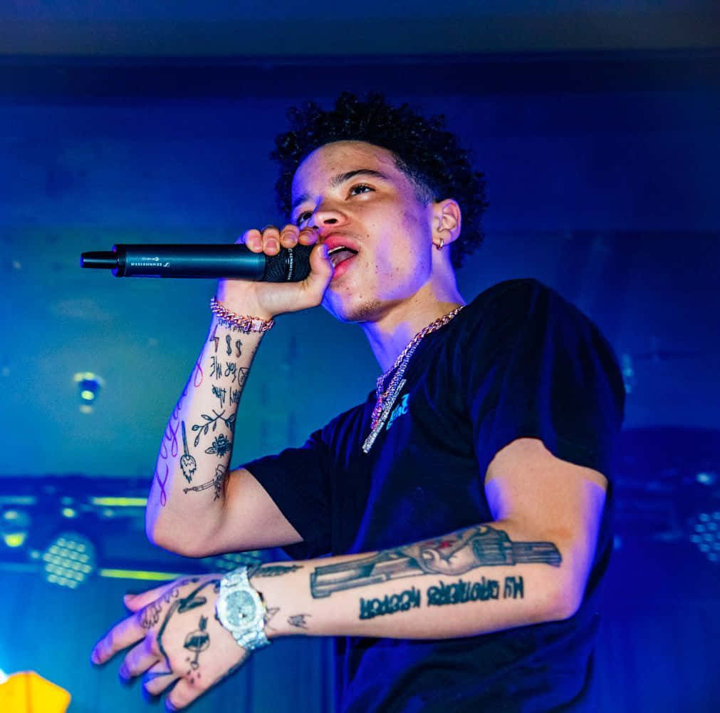 American rapper, singer, and songwriter Lil Mosey performs on stage. Wallpaper