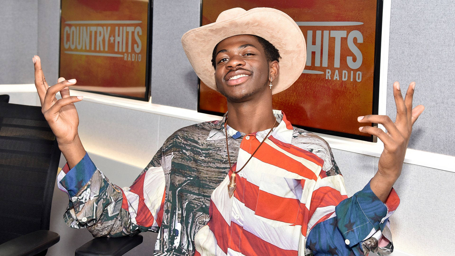 Lil Nas X Cowboy Striped Outfit Background