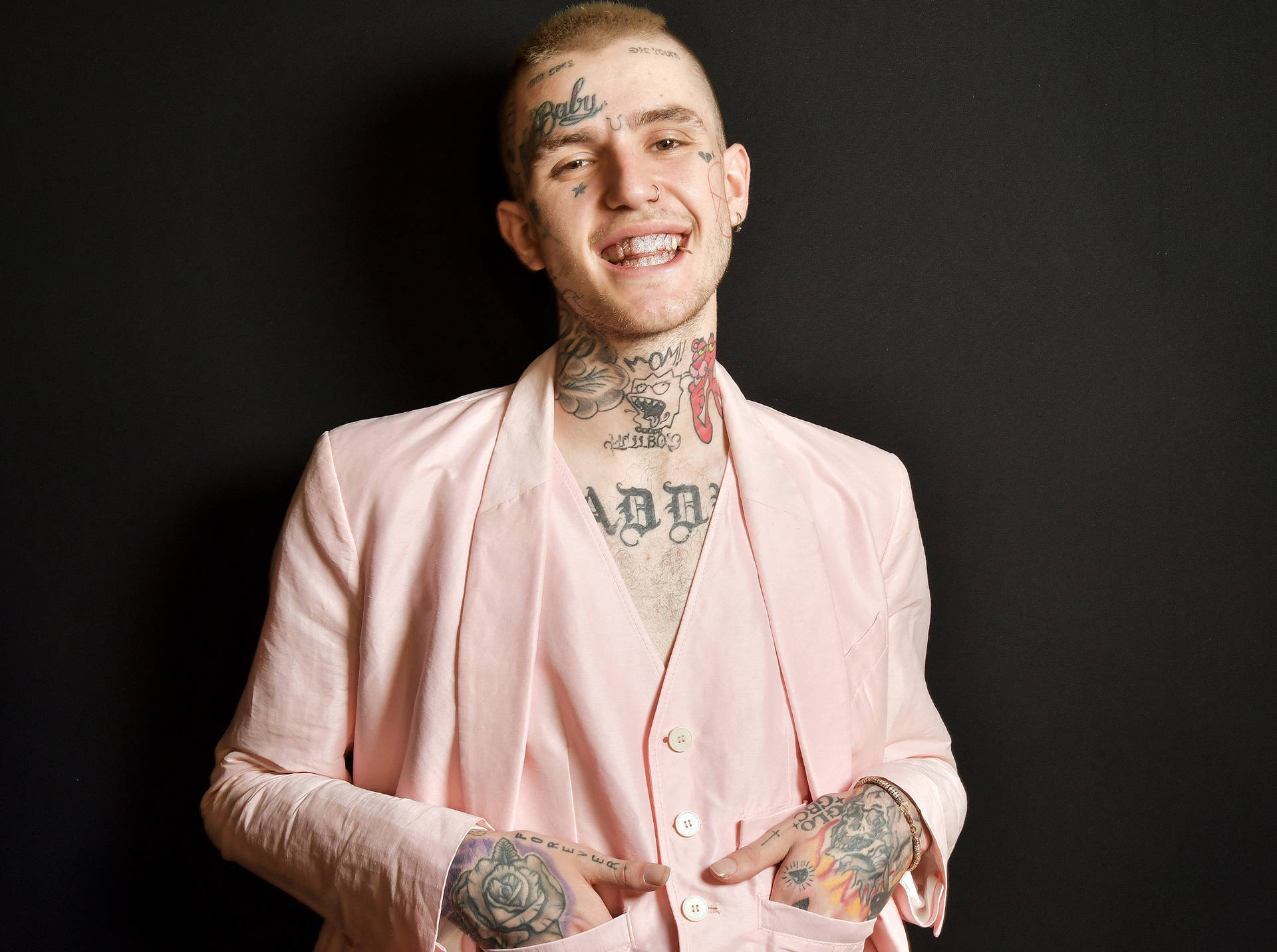 Rapper Lil Peep Performing in Pink Suit Wallpaper