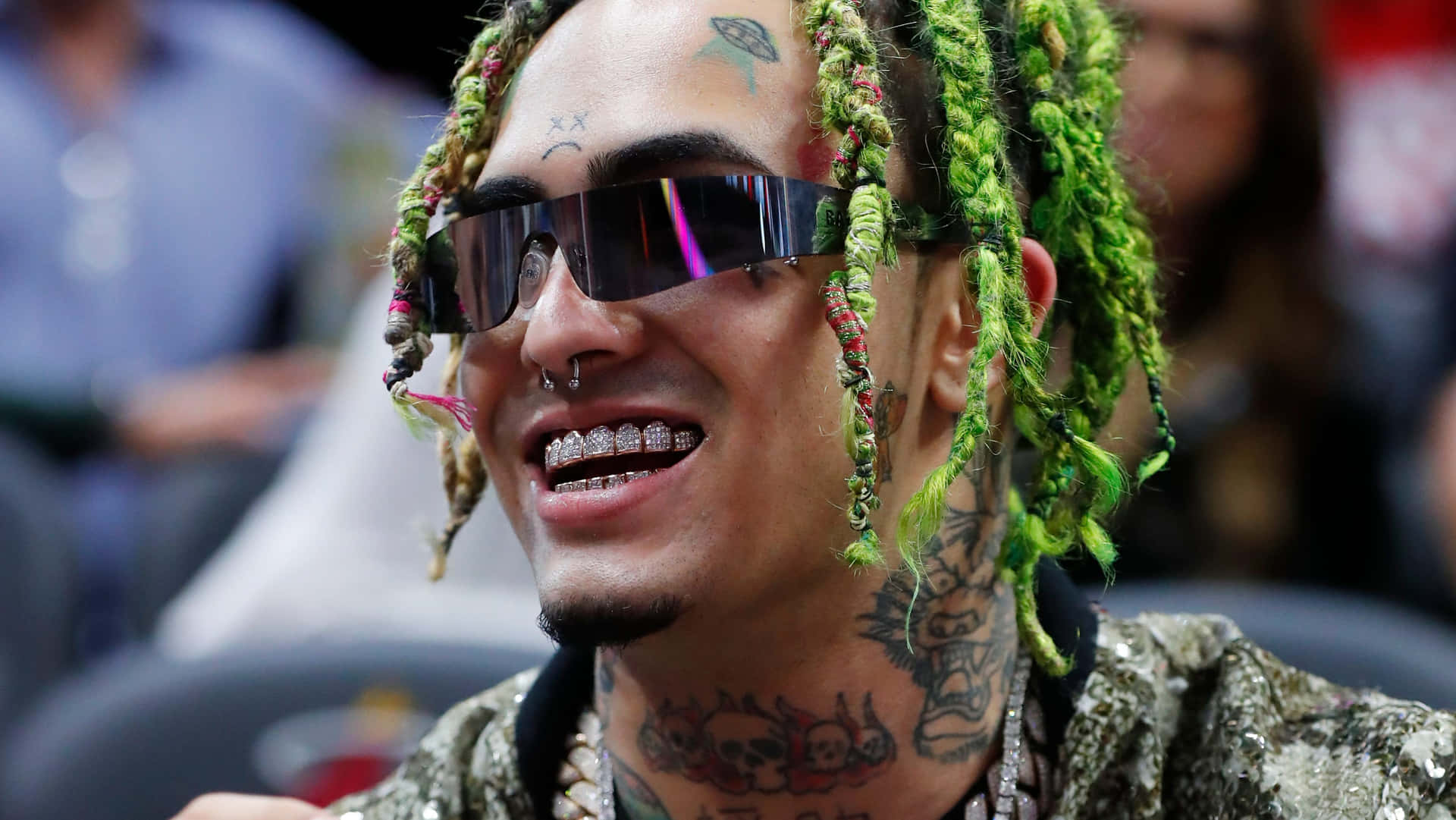 A Man With Green Dreadlocks And Sunglasses Is Smiling Wallpaper