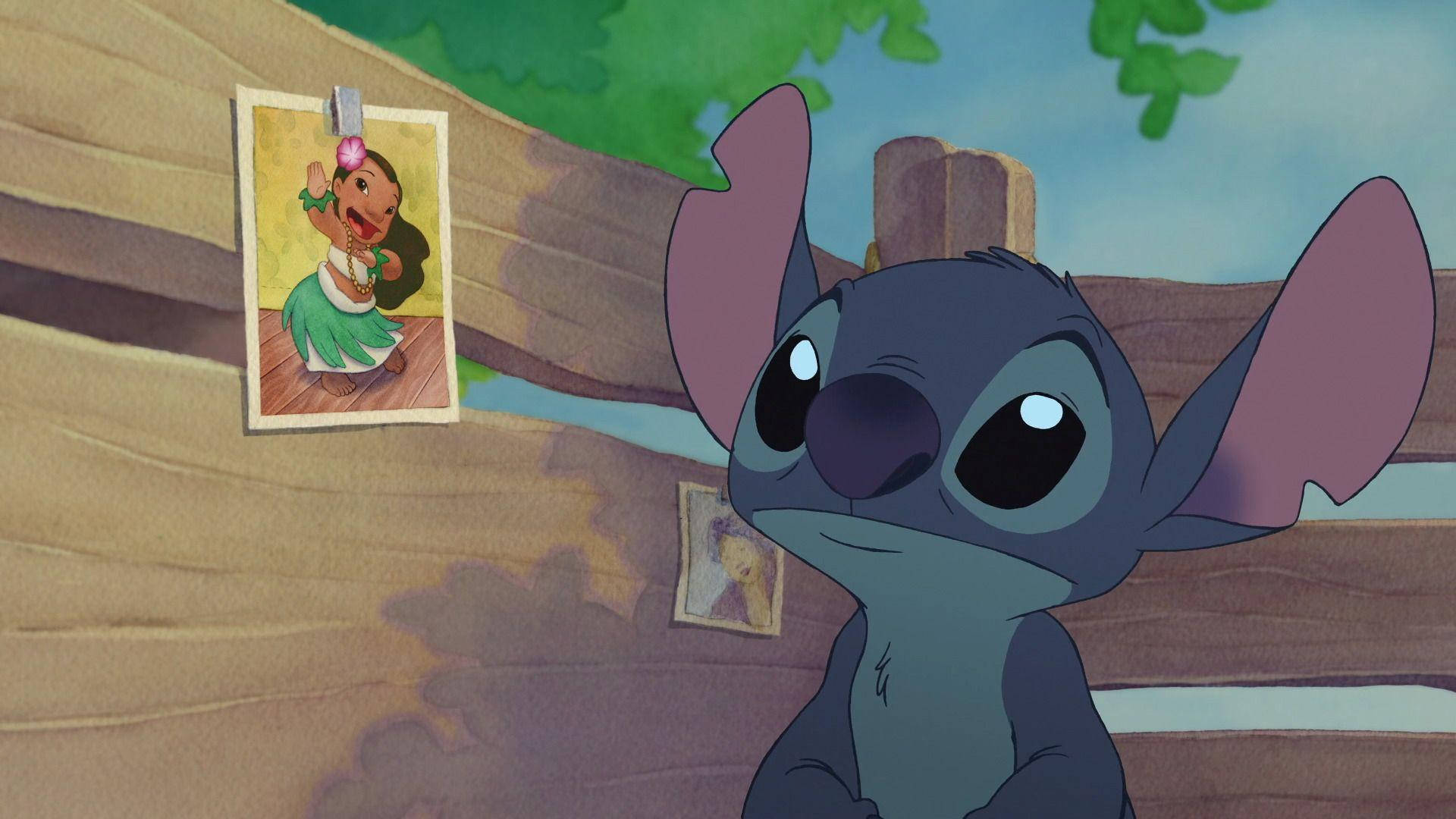 Lilo Stitch Looking At A Picture Wallpaper