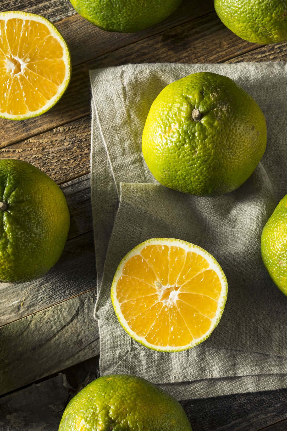 Grøn limeskal Uglis Citrus Frugter Og Skiver Mønster Wallpaper
