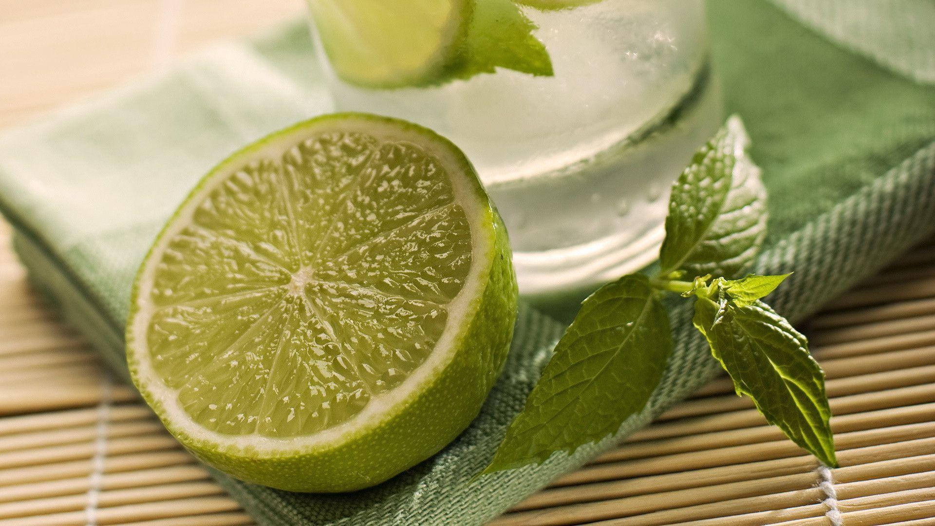 Refreshing Lime Water with Mint Leaves Wallpaper