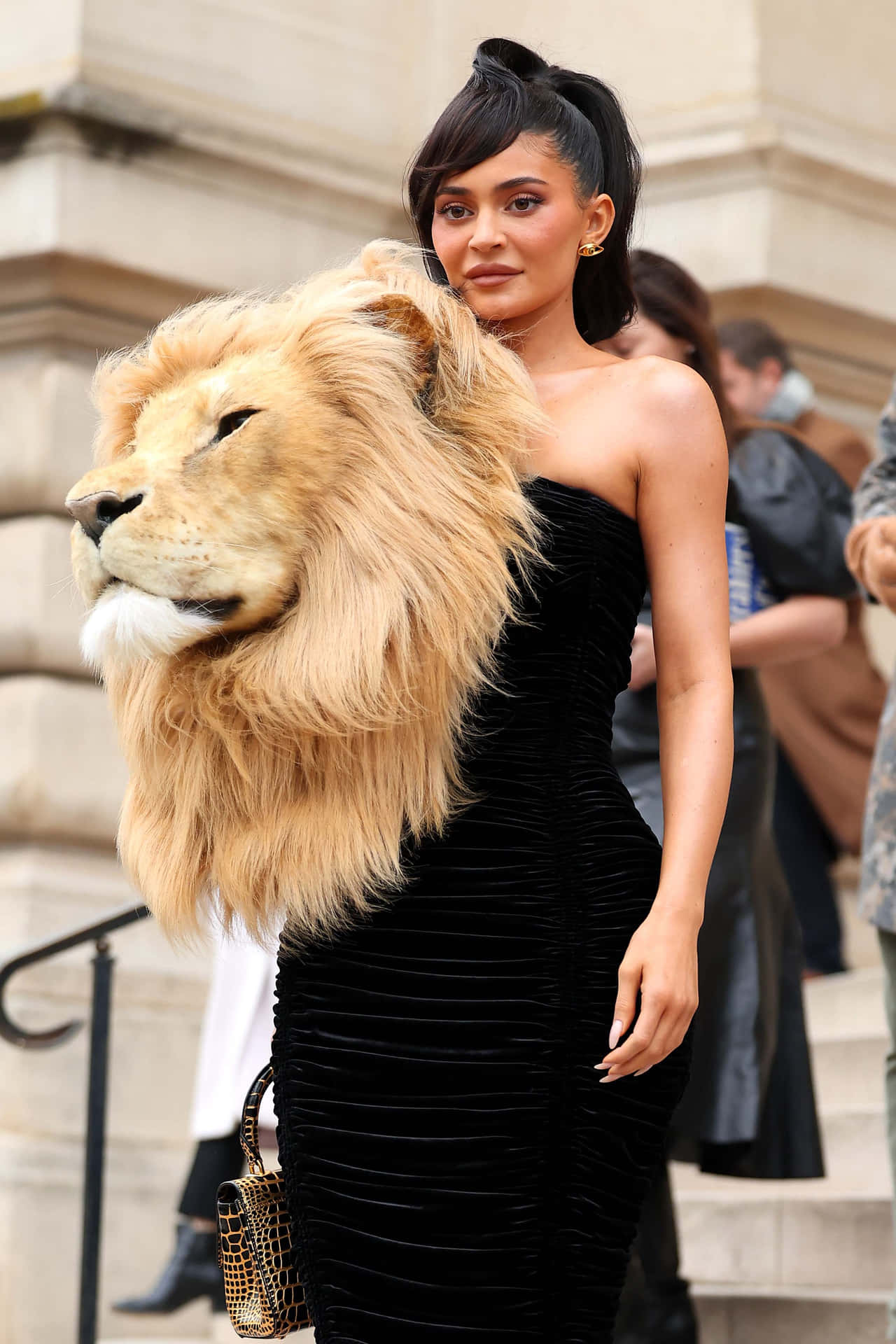 A Woman Wearing A Lion Head Dress