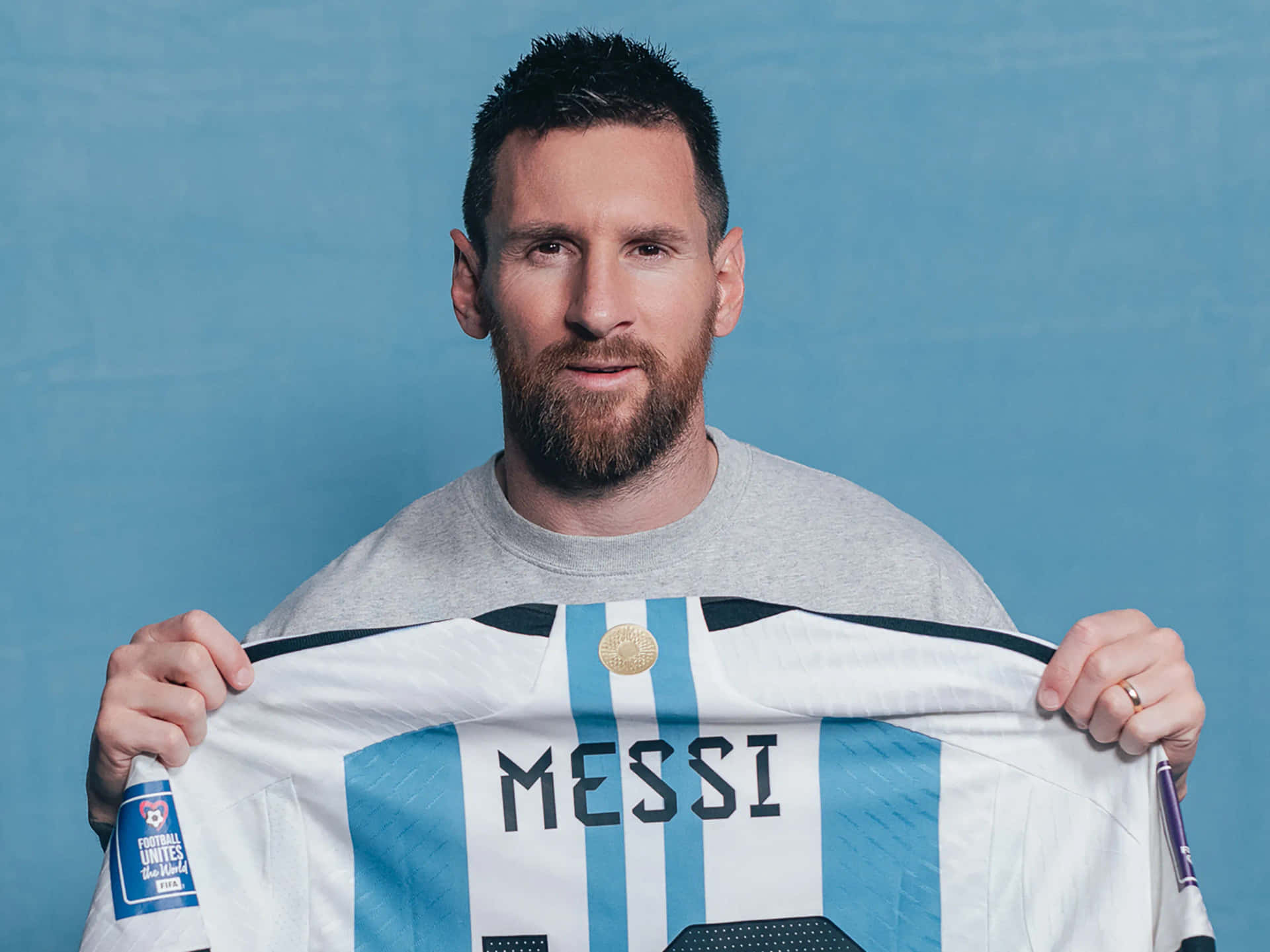 Lionel Messi Holding Argentina Jersey Wallpaper