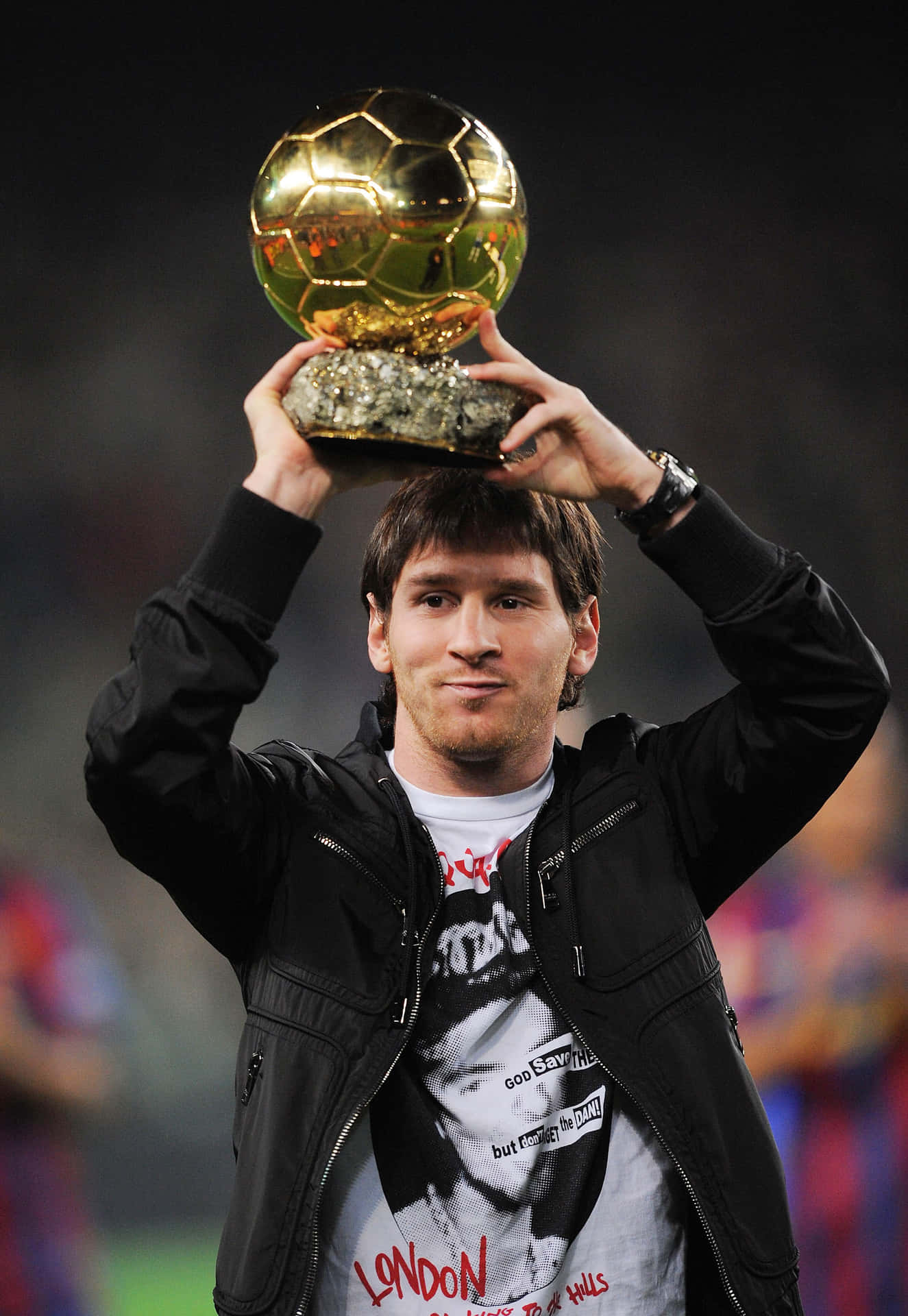 Lionel Messi Holding His Seventh Ballon D'or Award Wallpaper