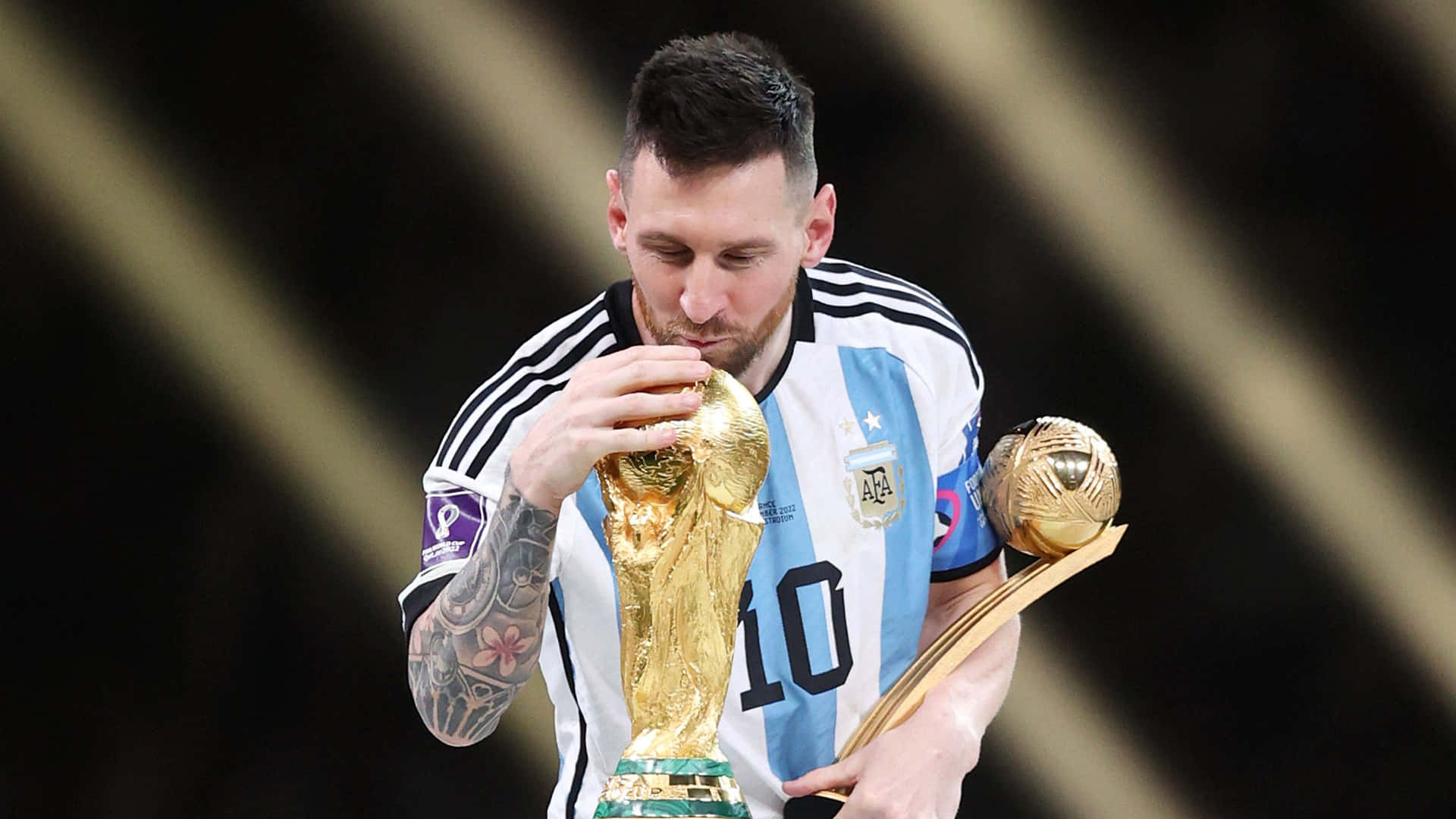 Download Lionel Messi Kissing World Cup Trophy Wallpaper | Wallpapers.com