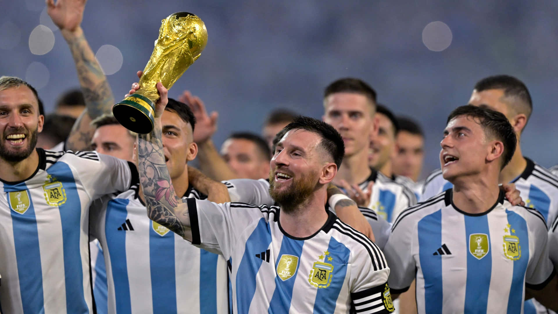 Lionel Messi Lifting World Cup Trophy With Team Wallpaper
