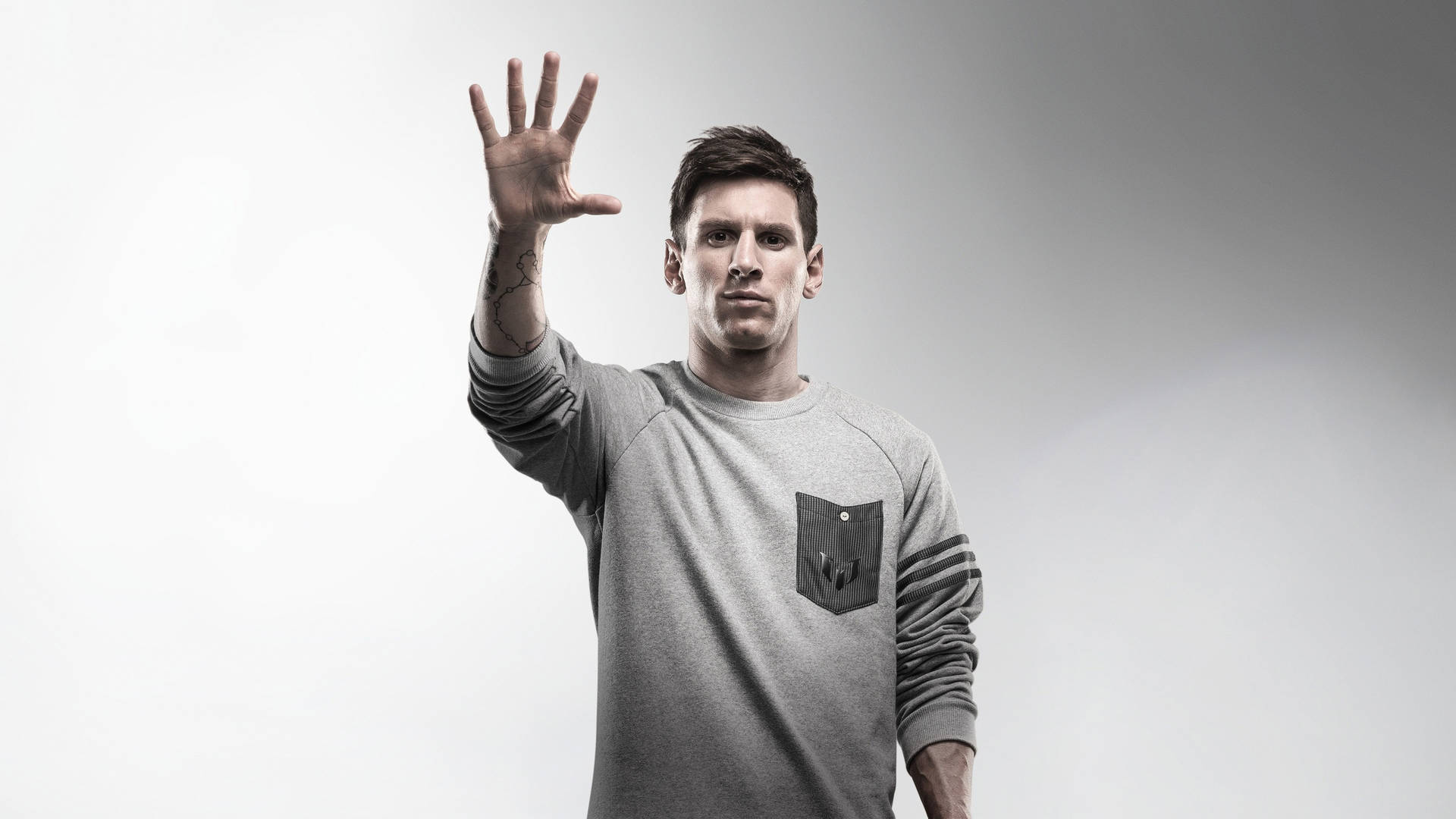 Lionel Messi With His Hand Out Wallpaper