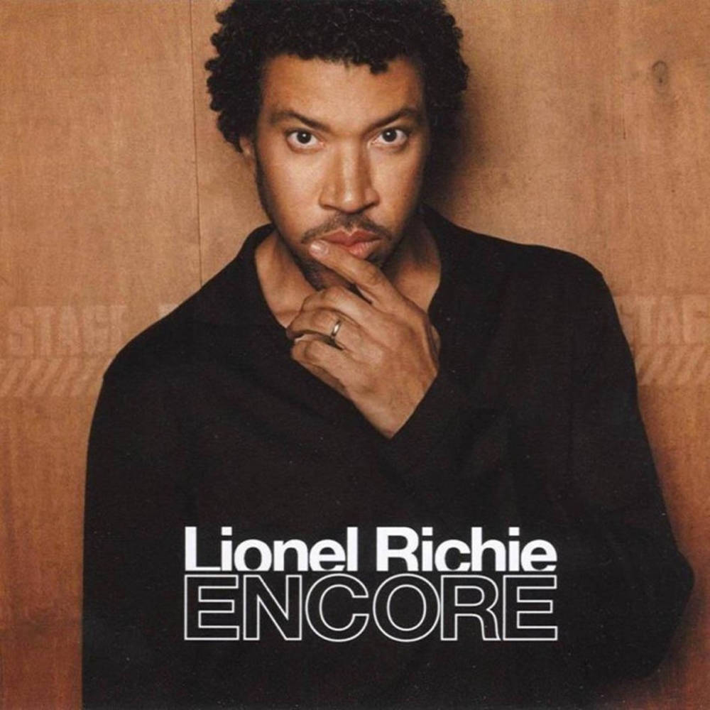 Lionel Richie Energetically Performing on the Cover of His Encore Album Wallpaper