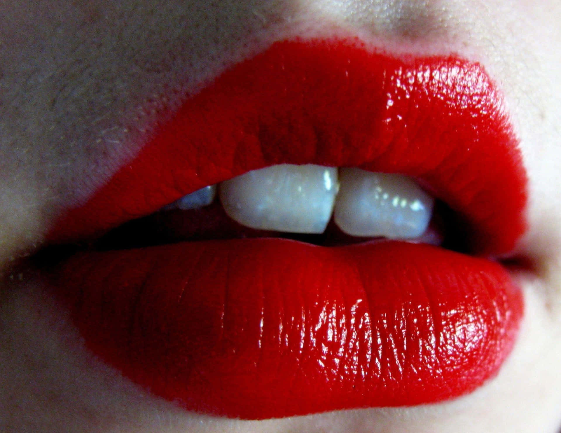 Caption: Closeup view of luscious red lips