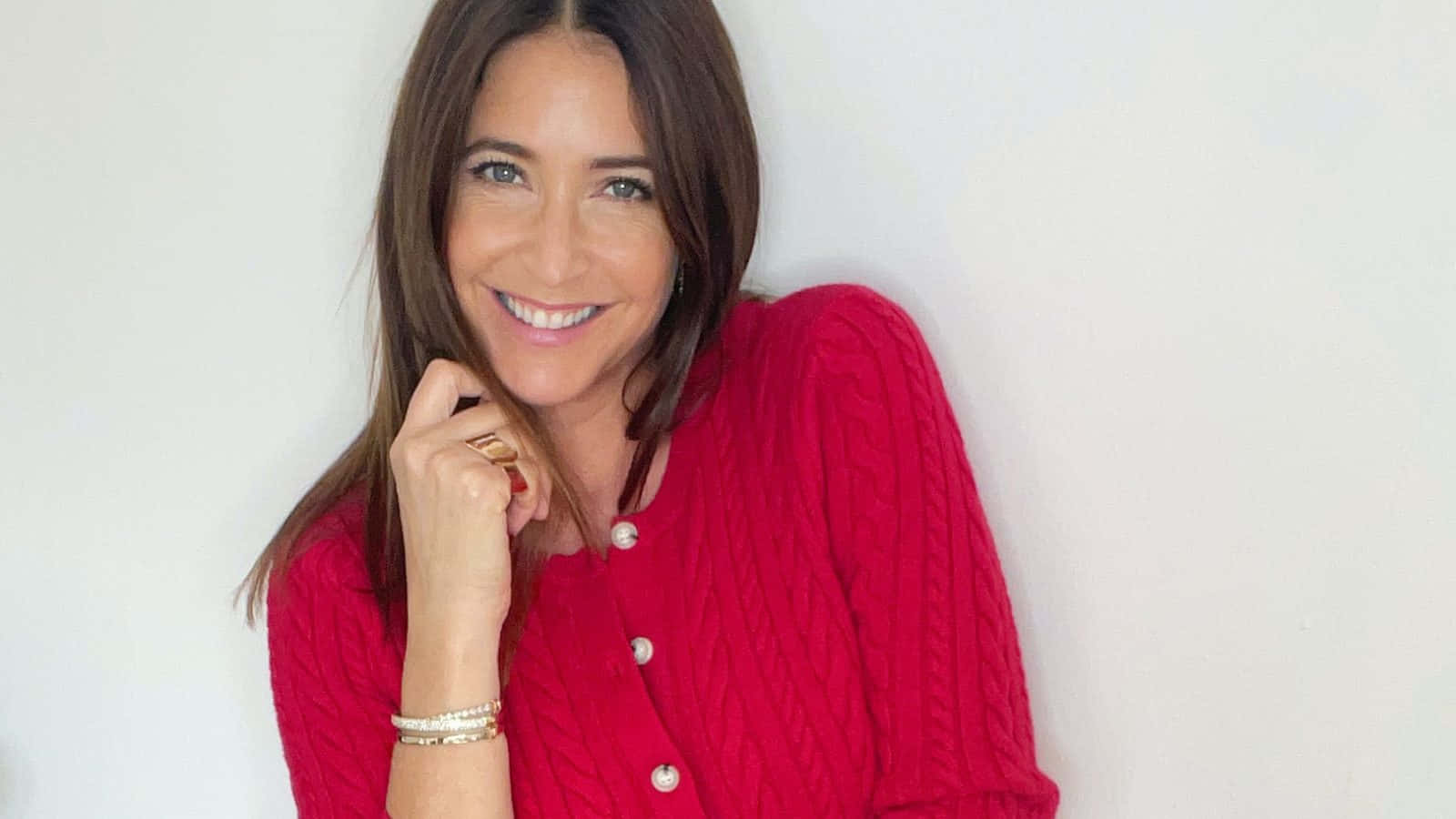 Lisa Snowdon Smilingin Red Sweater Wallpaper