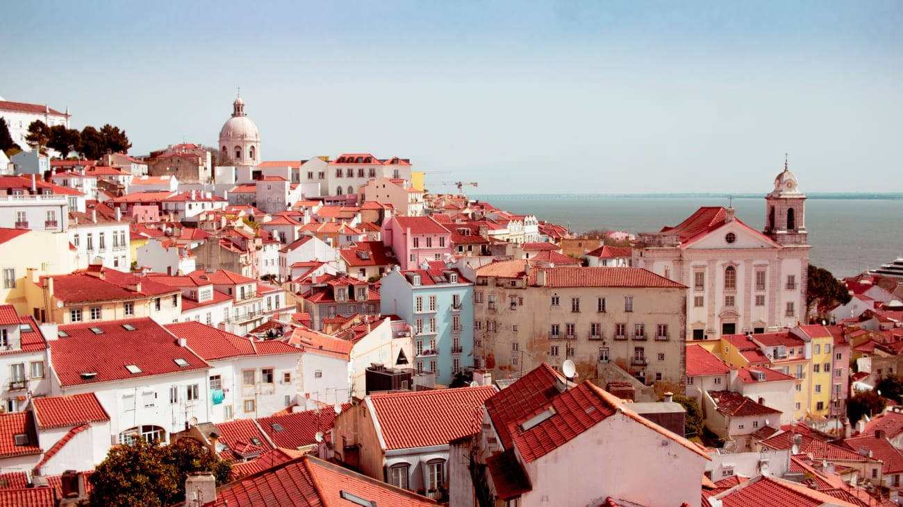 The Idyllic Charm of Lisbon's Scenic Coastline Wallpaper