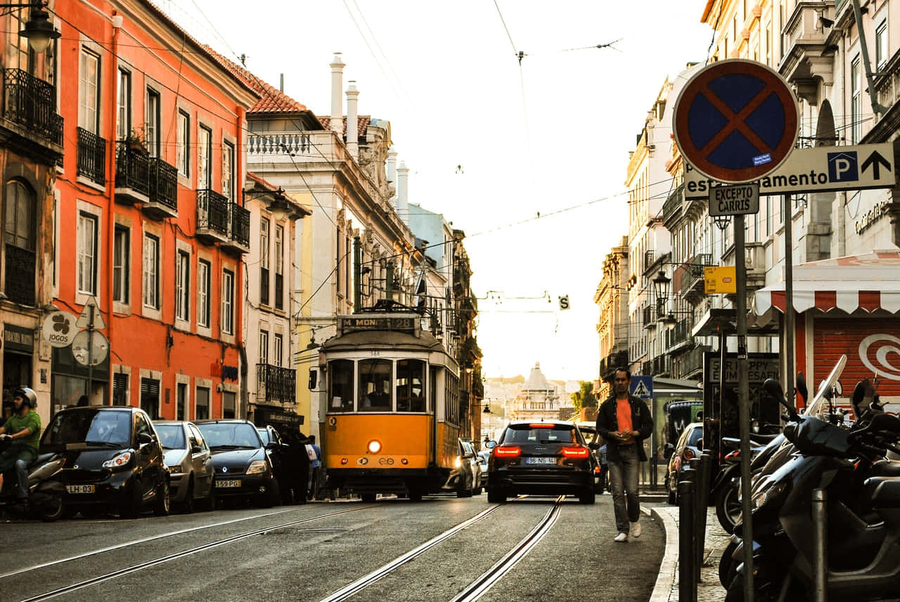 Download Lisbon Tram Street Scene Wallpaper | Wallpapers.com