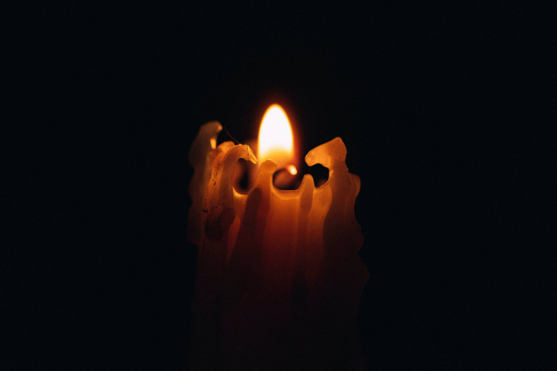 Lit Wax Candle Wallpaper