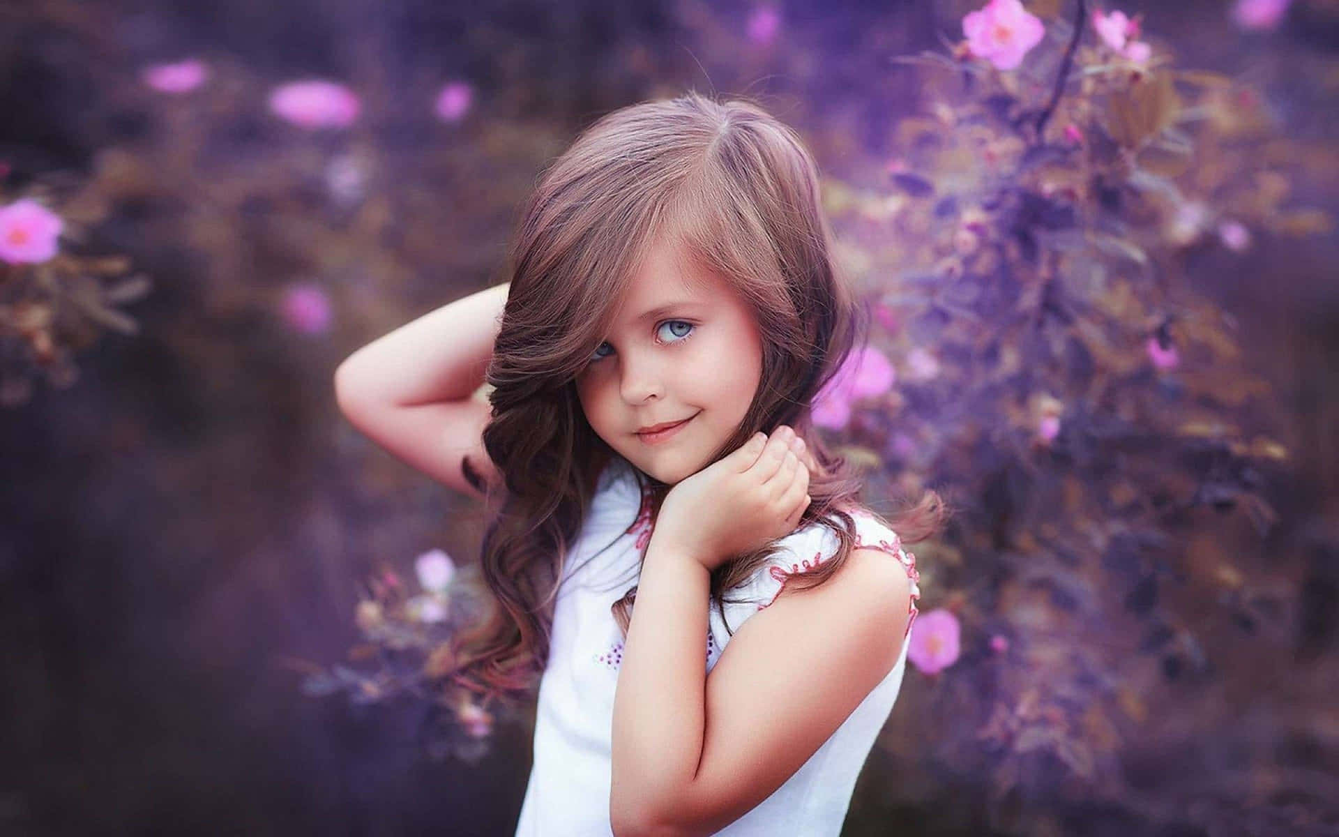Little Girl In Purple Floral Backdrop.jpg Wallpaper