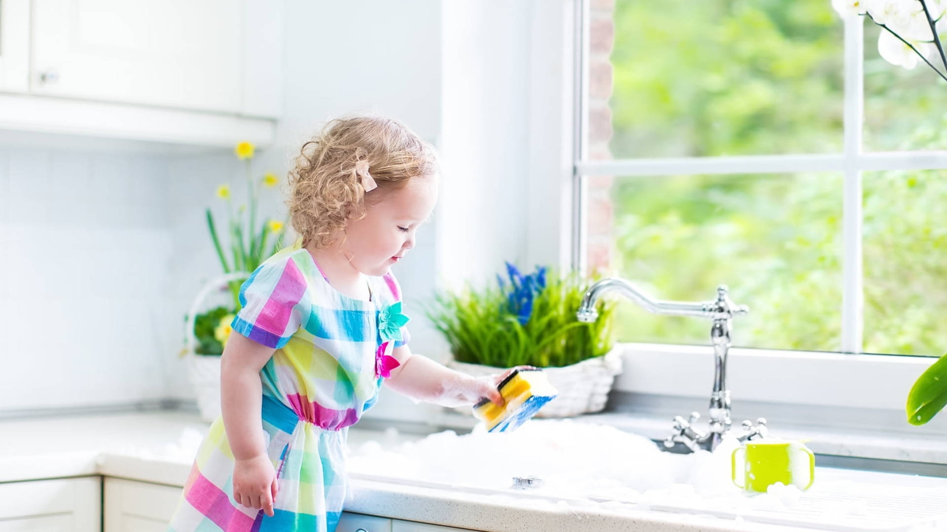 Young Child Engaged in House Cleaning Task Wallpaper