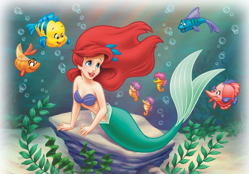 Ariel, Den Lille Havfrue, drømmende at udforske et magisk havmiljø. Wallpaper
