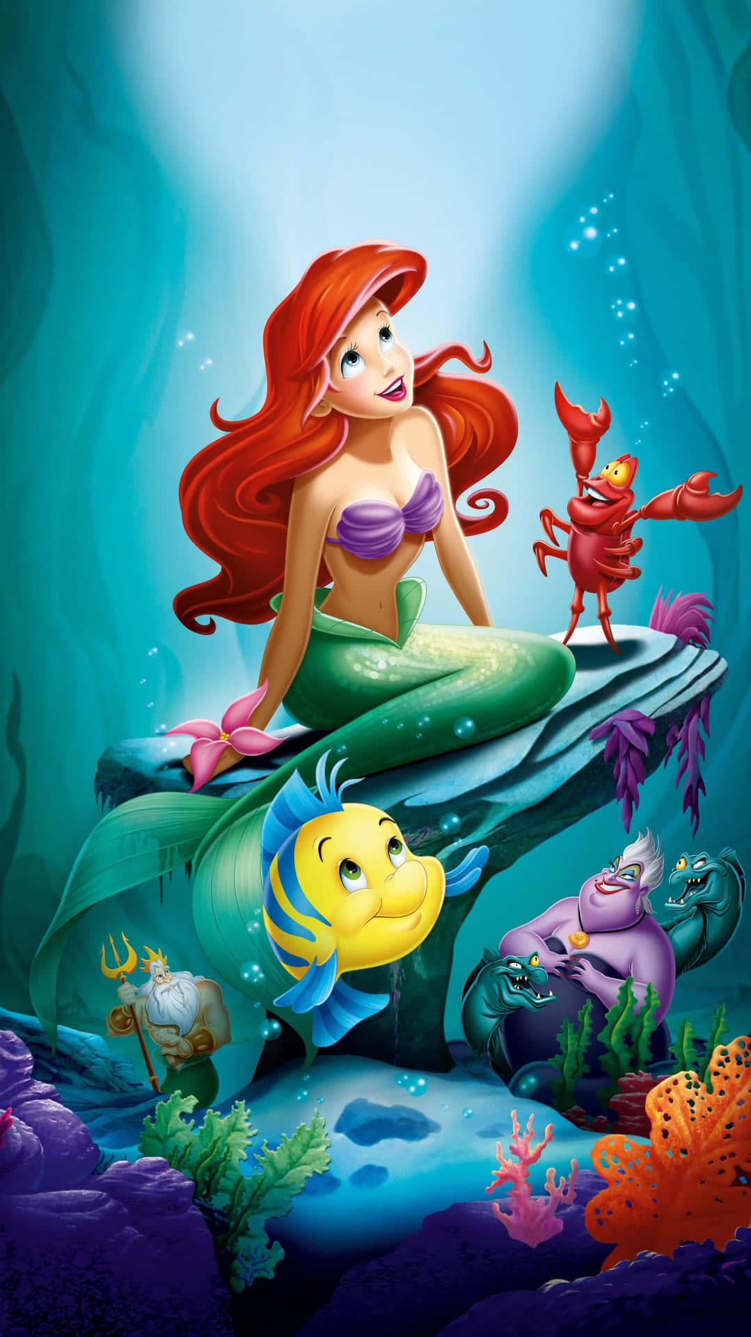 Ariel singing along in the vibrant underwater world of The Little Mermaid Wallpaper