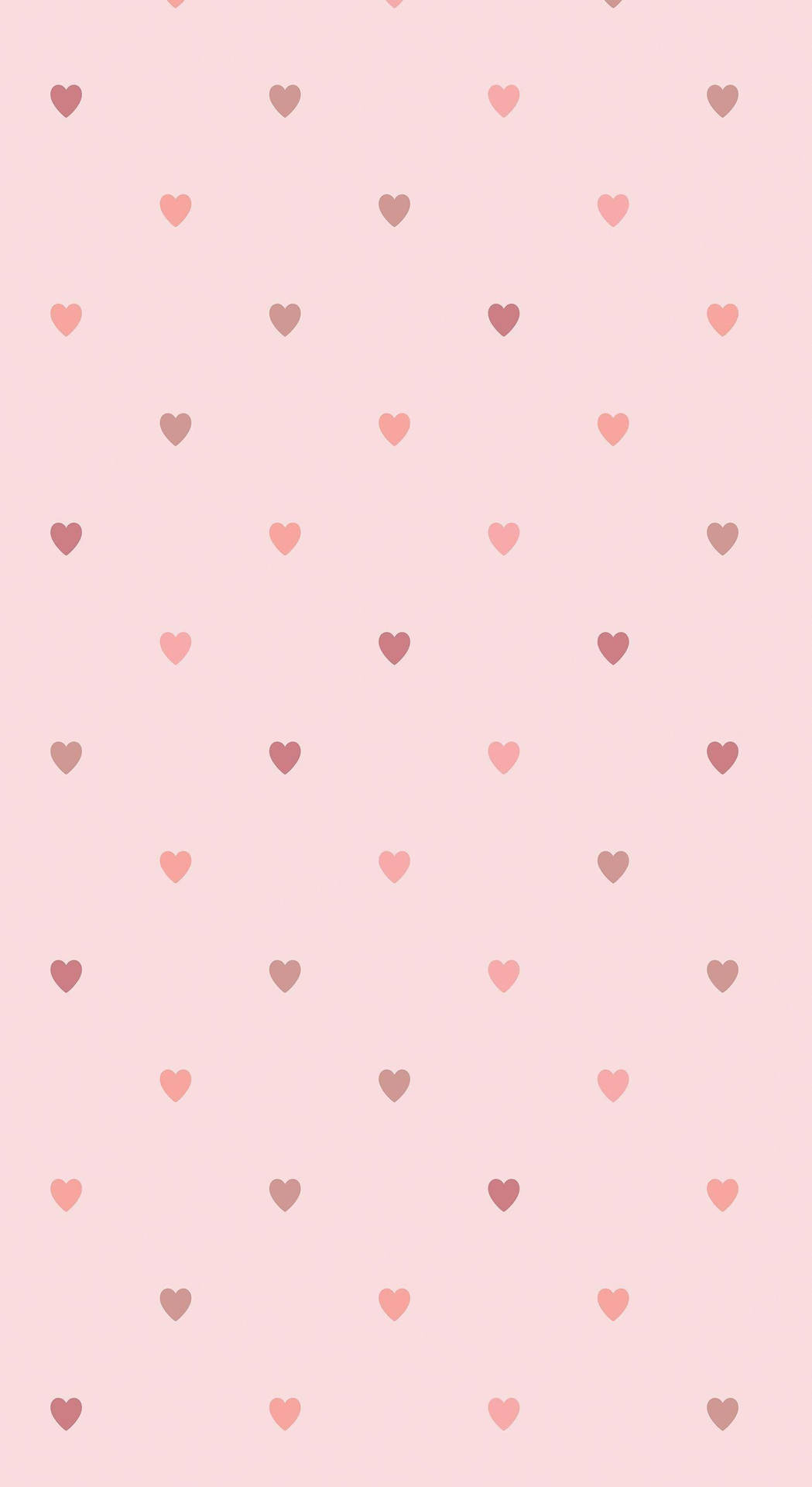 Lille pastel pink hjerteformede figurer på en neutral beige baggrund. Wallpaper