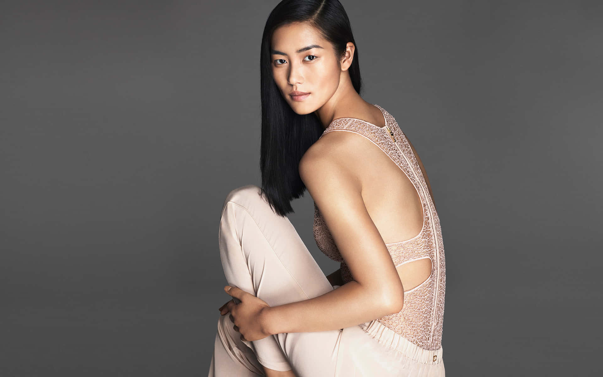 Liu Wen, International Supermodel, Striking A Pose During A Photo Shoot. Wallpaper