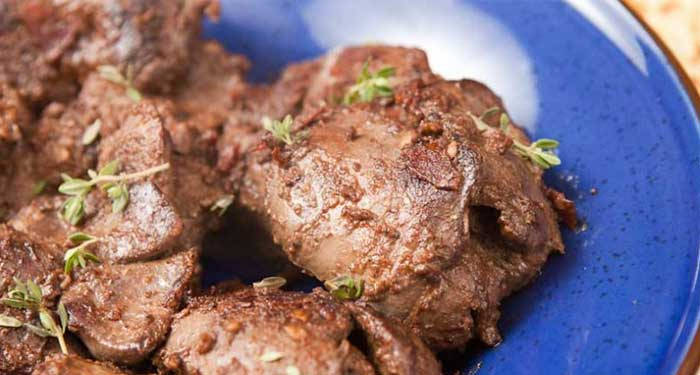 Savory Liver Chunks Topped with Fresh Herbs Wallpaper