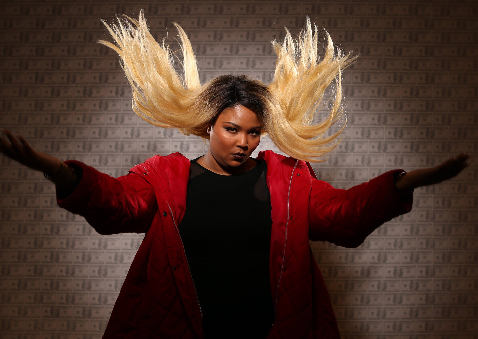 Lizzo Flipping Her Blonde Hair Background