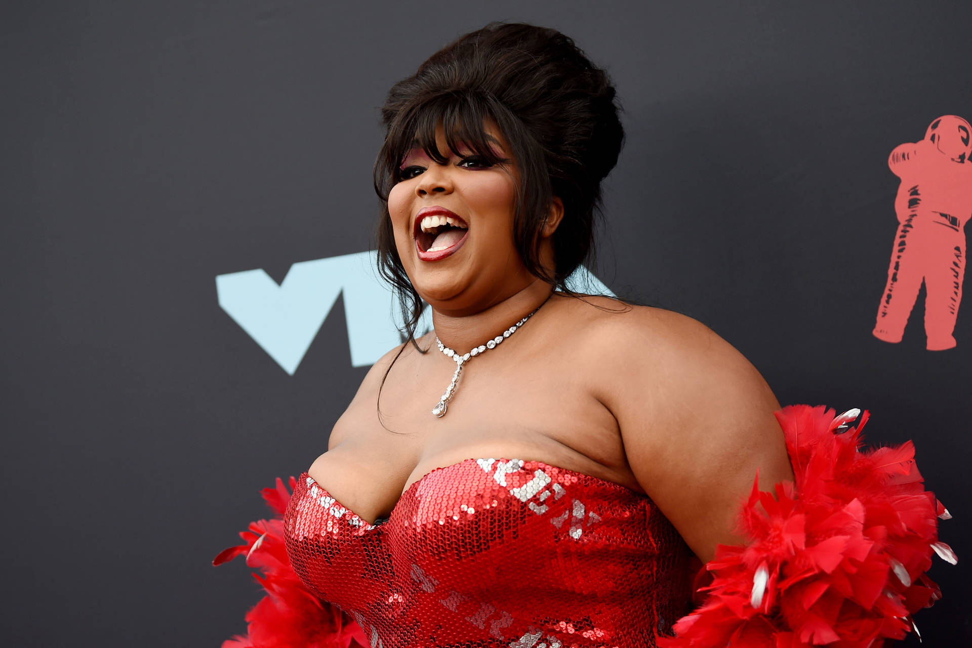 Lizzo In Red Siren Gown Background