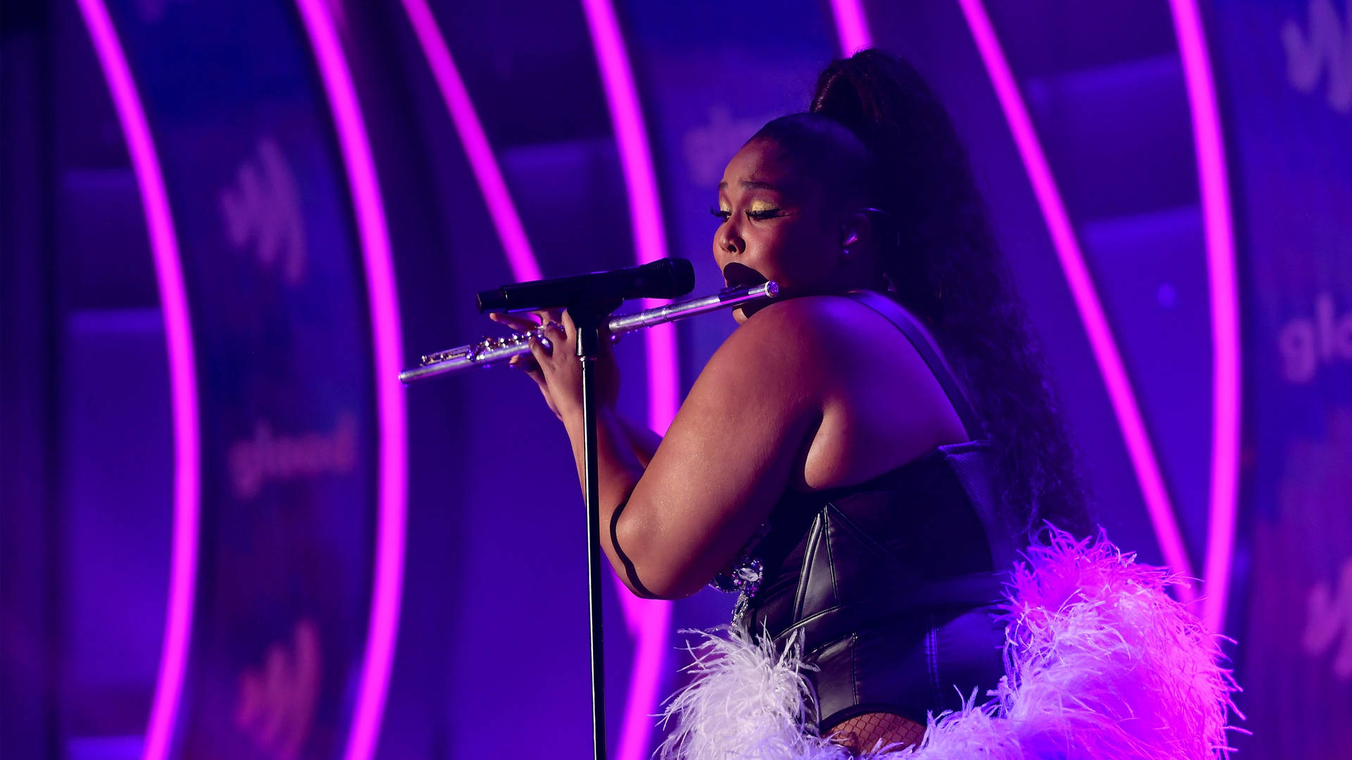 Lizzo Playing Flute Glaad Event Background