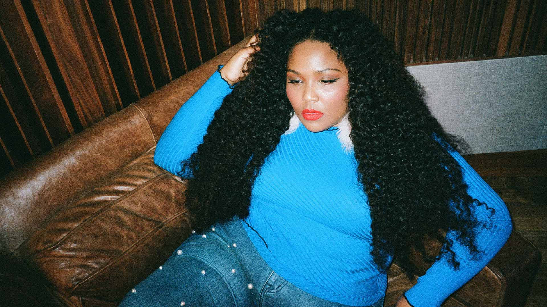 Lizzo With Curly Hair Background