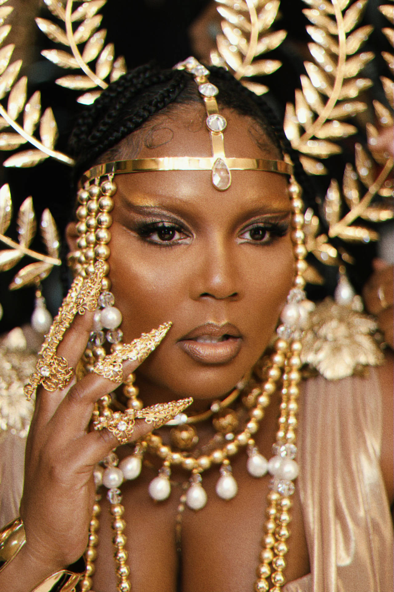 Lizzo With Glamours Headdress Background